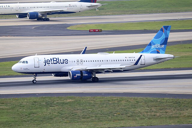 An image of a JetBlue A320 landing in Atlanta.